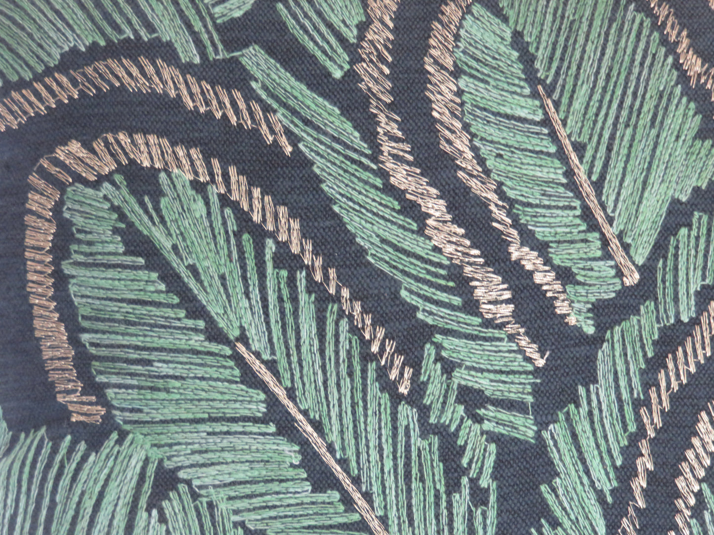 embroidered leaves pillow cover in jade green and metallic bronze on dark blue cotton