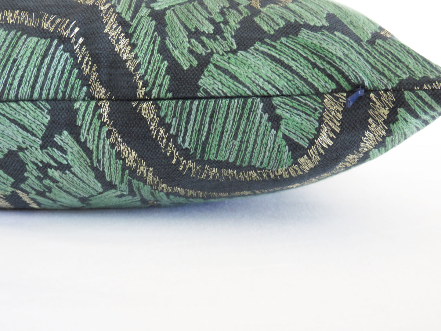 embroidered leaves pillow cover in jade green and metallic bronze on dark blue cotton