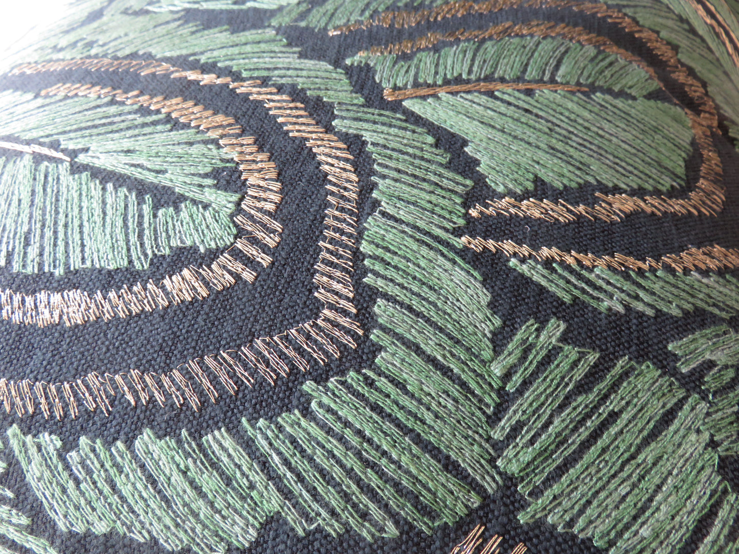 embroidered leaves pillow cover in jade green and metallic bronze on dark blue cotton