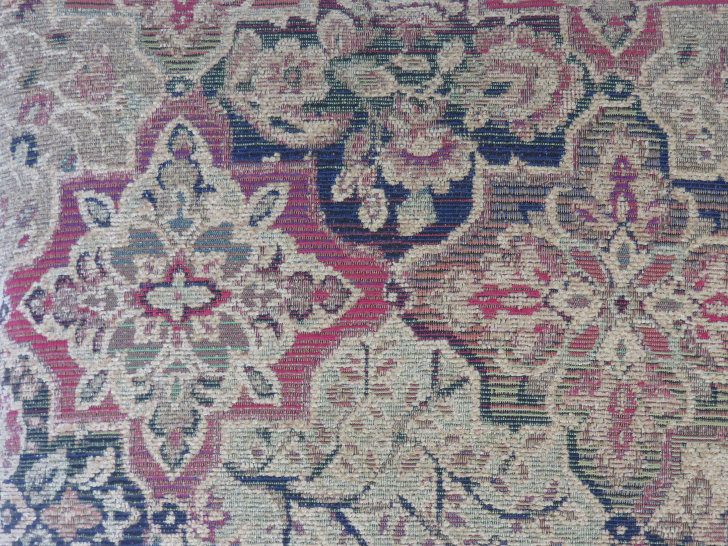 jewel tone chenille medallion pillow cover with a quatrefoil motif in gold, red, green, and blue