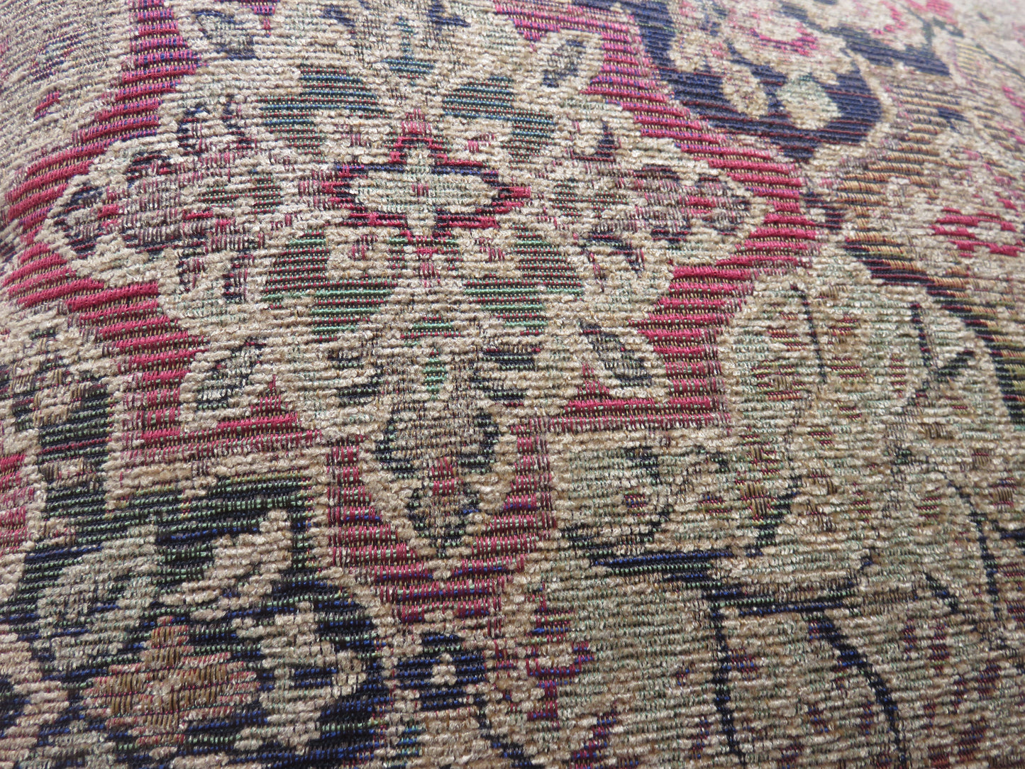 jewel tone chenille medallion pillow cover with a quatrefoil motif in gold, red, green, and blue