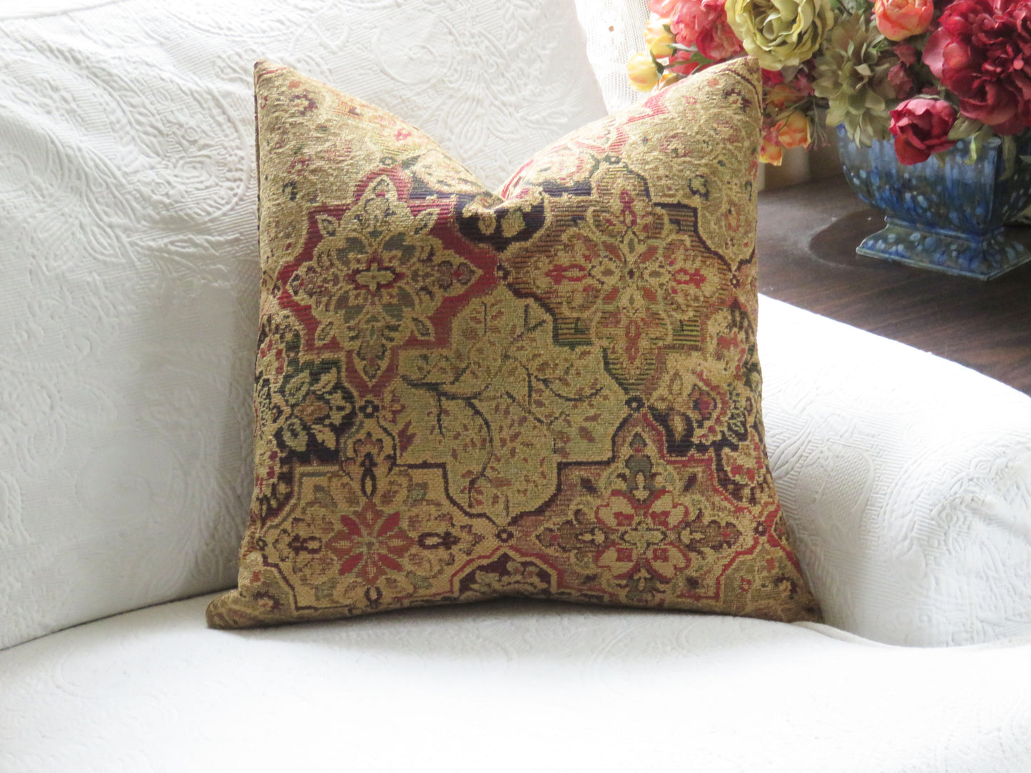 jewel tone chenille medallion pillow cover with a quatrefoil motif in gold, red, green, and blue