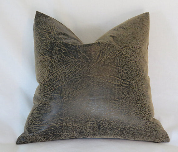 distressed faux leather pillow in brown