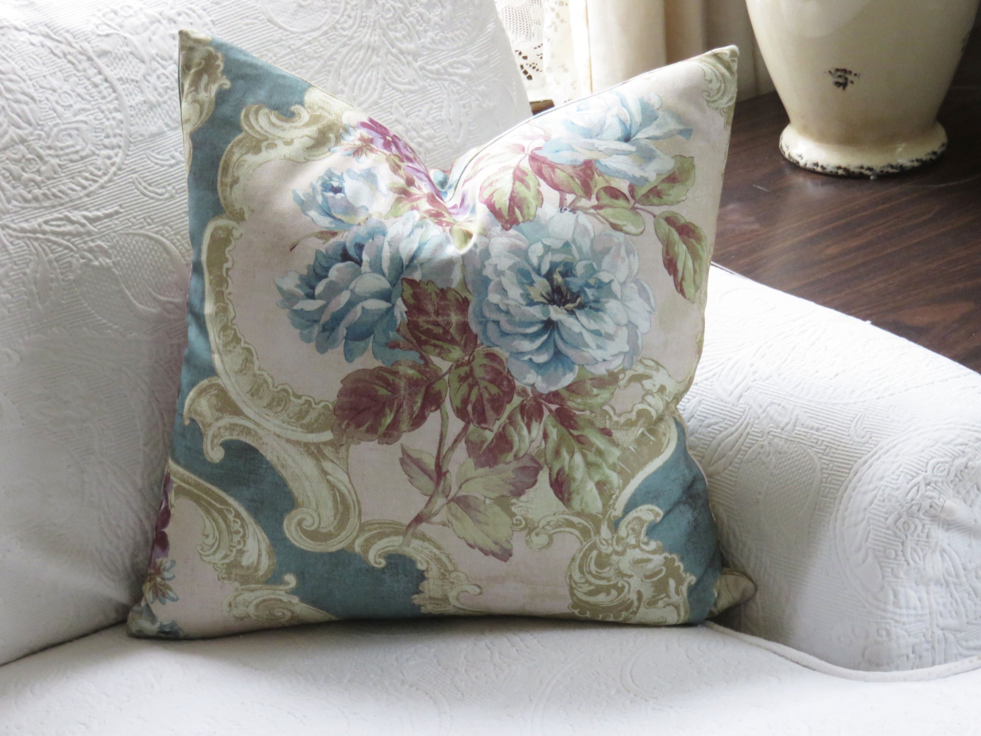 blue roses floral pillow cover on aqua cotton with a rococo style