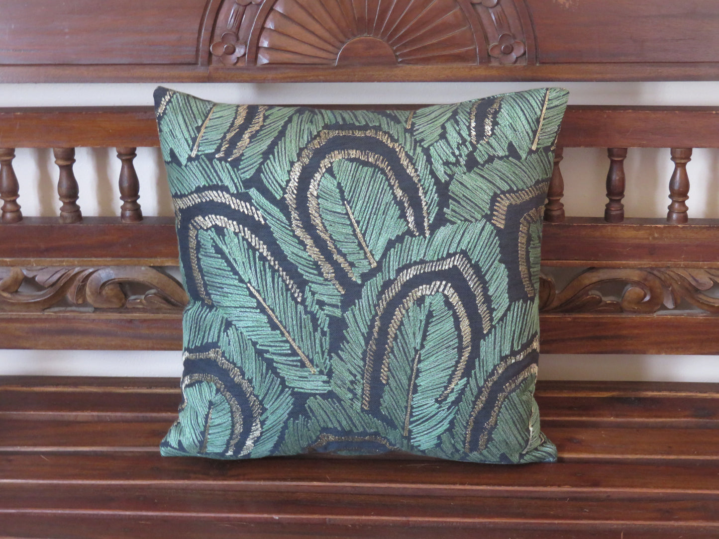 embroidered leaves pillow cover in jade green and metallic bronze on dark blue cotton