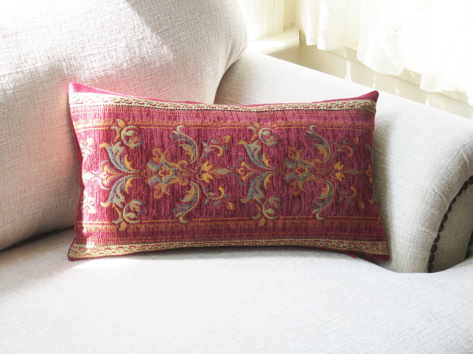 faded rose red chenille tapestry pillow cover in a lumbar shape