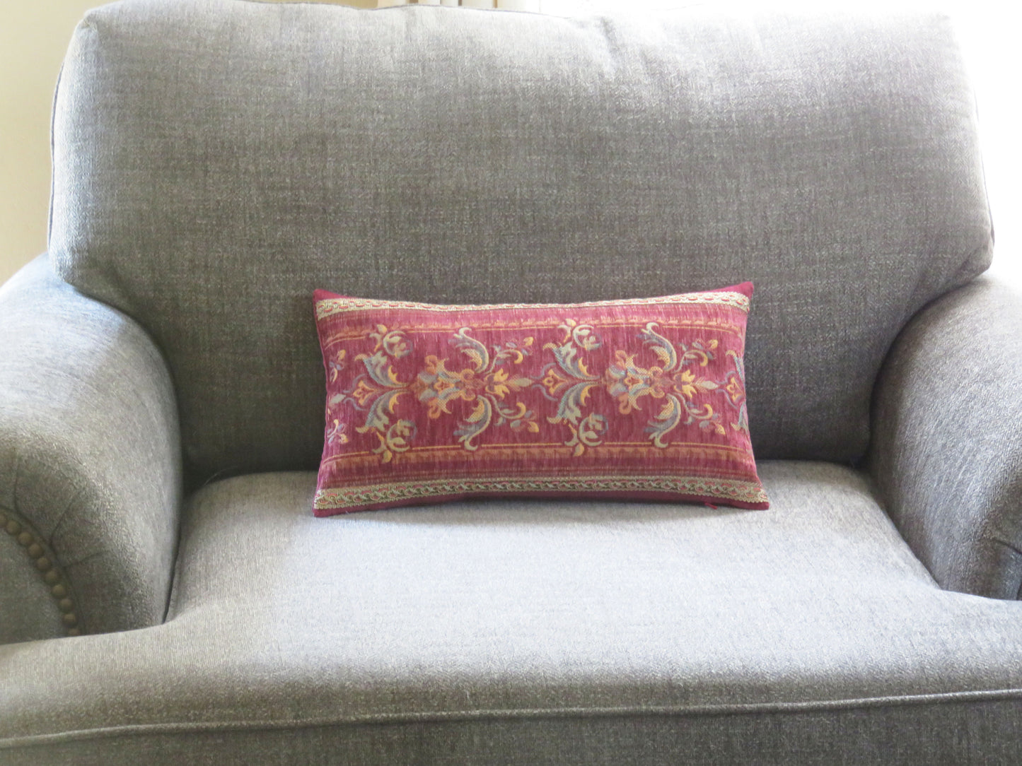 faded rose red chenille tapestry pillow cover in a lumbar shape