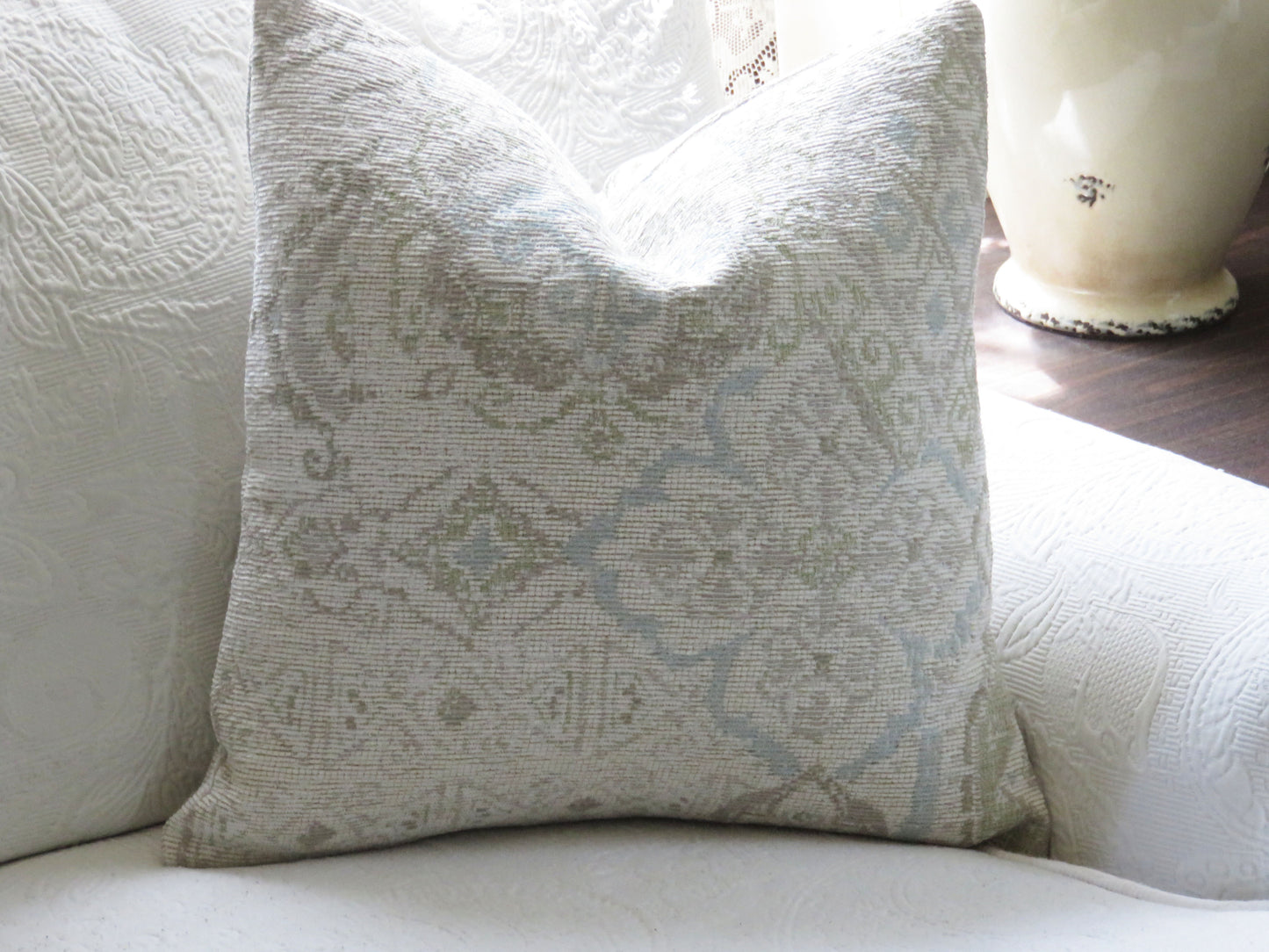 white, taupe, and pale blue kilim motif pillow cover