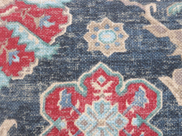 red and blue medallion pillow cover made from Covington Bashir fabric in ink