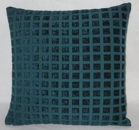 Patchwork carpet style pillow cover in tan, blue, and red