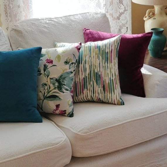 Teal and purple coordinating pillows with kelly ripa print