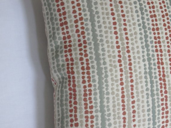 terracotta orange and grey rows of dots pillow