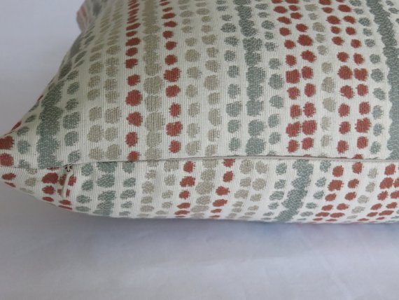 terracotta orange and grey rows of dots pillow