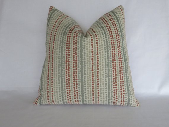 terracotta orange and grey rows of dots pillow