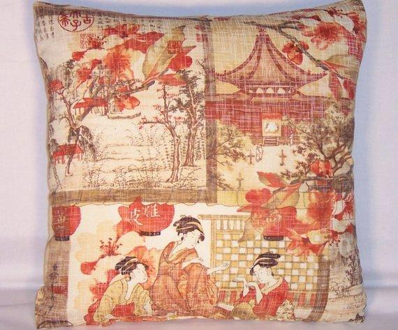 orange brown oriental pillow with geishas